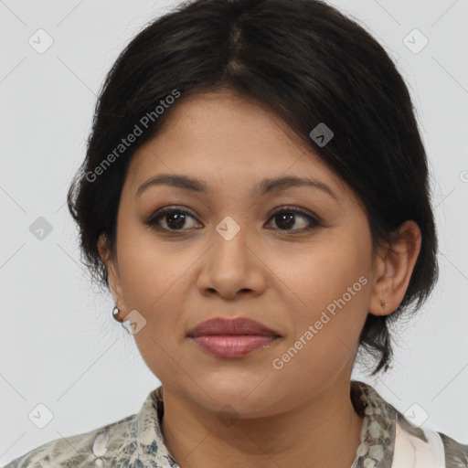 Joyful latino young-adult female with medium  brown hair and brown eyes