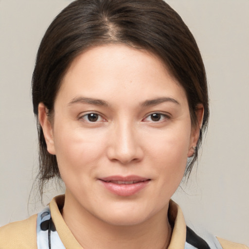 Joyful white young-adult female with medium  brown hair and brown eyes