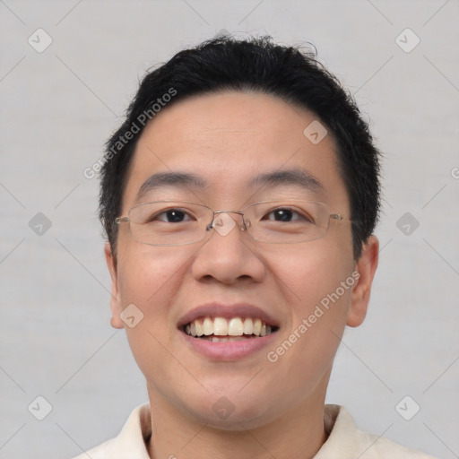 Joyful white young-adult male with short  black hair and brown eyes