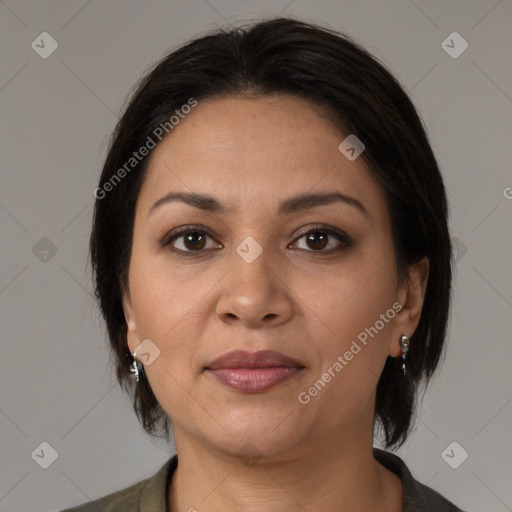 Joyful latino young-adult female with medium  brown hair and brown eyes