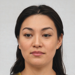 Joyful asian young-adult female with medium  brown hair and brown eyes