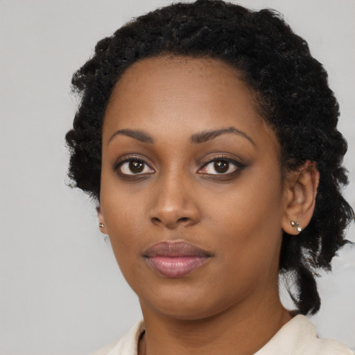 Neutral black young-adult female with medium  black hair and brown eyes