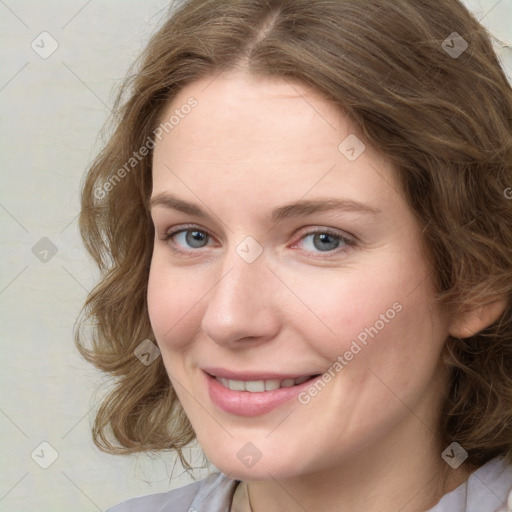 Joyful white young-adult female with medium  brown hair and green eyes