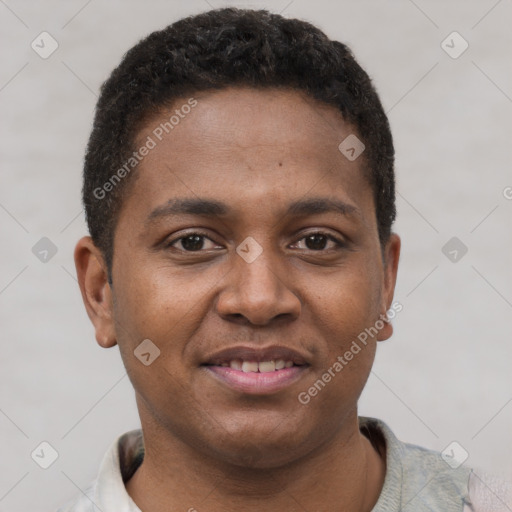 Joyful latino young-adult male with short  brown hair and brown eyes