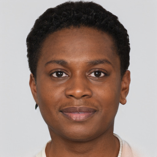 Joyful black young-adult female with short  brown hair and brown eyes