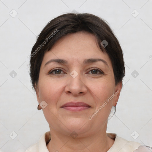 Joyful white adult female with short  brown hair and brown eyes