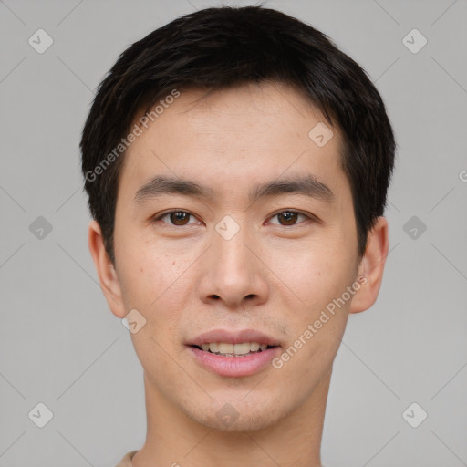 Joyful asian young-adult male with short  brown hair and brown eyes