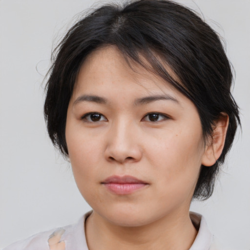 Neutral asian young-adult female with medium  brown hair and brown eyes