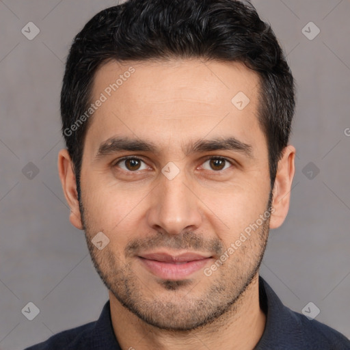 Joyful white young-adult male with short  black hair and brown eyes