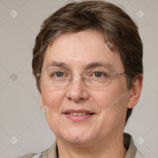 Joyful white adult female with short  brown hair and grey eyes