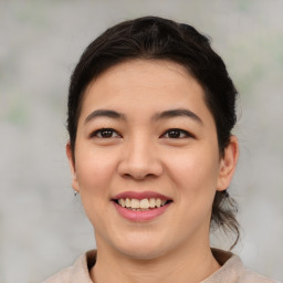 Joyful asian young-adult female with medium  brown hair and brown eyes