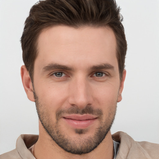 Joyful white young-adult male with short  brown hair and brown eyes