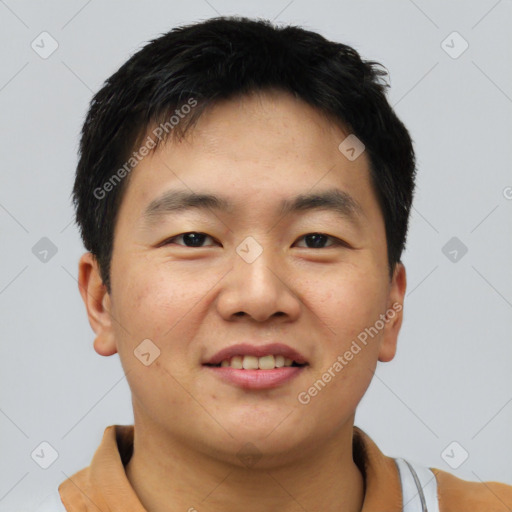 Joyful asian young-adult male with short  black hair and brown eyes