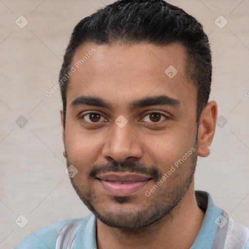 Joyful white young-adult male with short  black hair and brown eyes