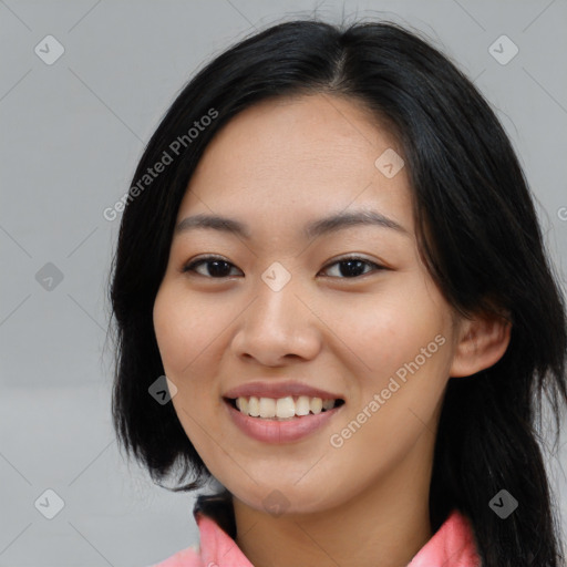 Joyful asian young-adult female with medium  black hair and brown eyes