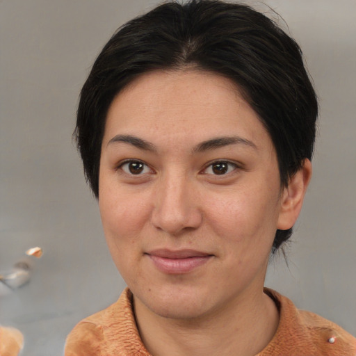 Joyful white adult female with medium  brown hair and brown eyes