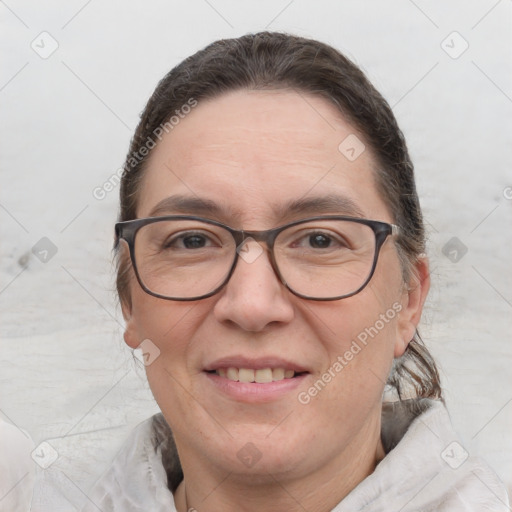 Joyful white adult female with short  brown hair and brown eyes