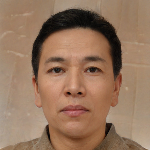 Neutral asian adult male with short  brown hair and brown eyes