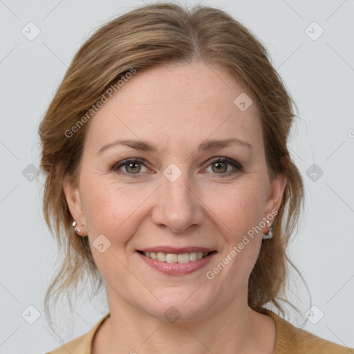 Joyful white adult female with medium  brown hair and grey eyes