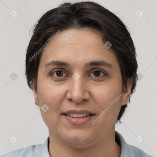 Joyful white adult female with short  brown hair and brown eyes