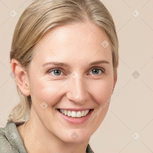 Joyful white young-adult female with medium  brown hair and blue eyes