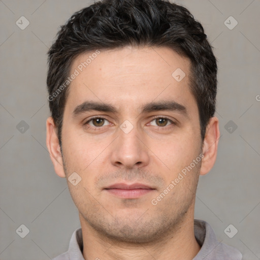 Joyful white young-adult male with short  black hair and brown eyes