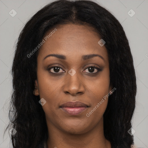 Joyful black young-adult female with long  brown hair and brown eyes