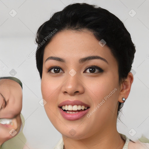 Joyful asian young-adult female with short  black hair and brown eyes