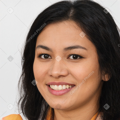 Joyful asian young-adult female with long  brown hair and brown eyes