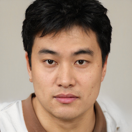 Neutral asian young-adult male with short  brown hair and brown eyes