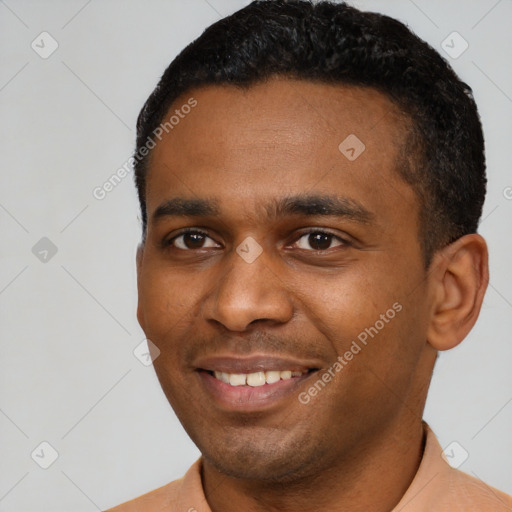 Joyful latino young-adult male with short  black hair and brown eyes