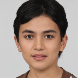 Joyful latino young-adult female with short  black hair and brown eyes