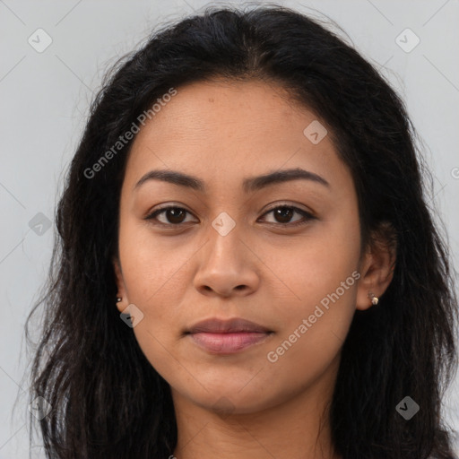 Joyful latino young-adult female with long  brown hair and brown eyes