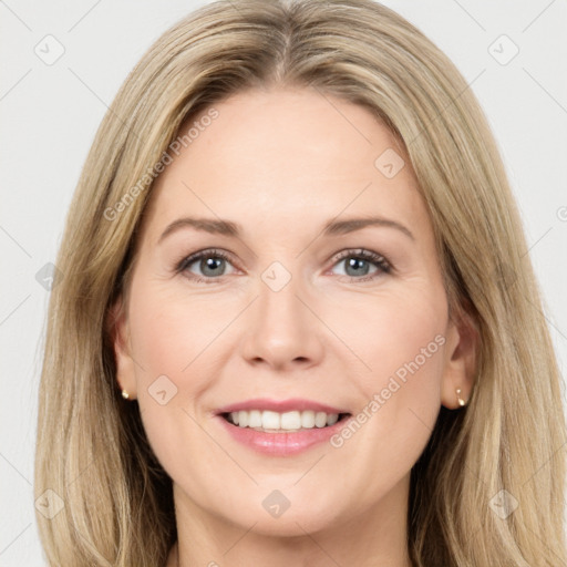 Joyful white young-adult female with long  brown hair and green eyes