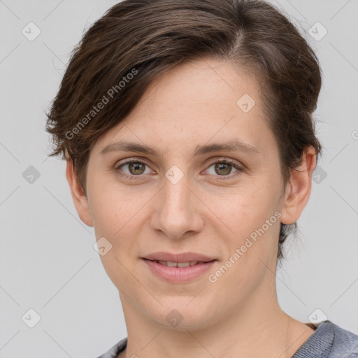 Joyful white young-adult female with short  brown hair and grey eyes