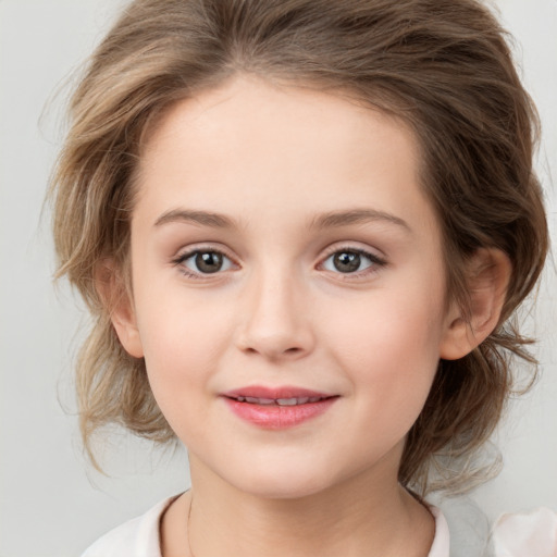 Joyful white child female with medium  brown hair and grey eyes