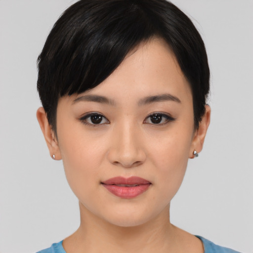 Joyful asian young-adult female with short  black hair and brown eyes