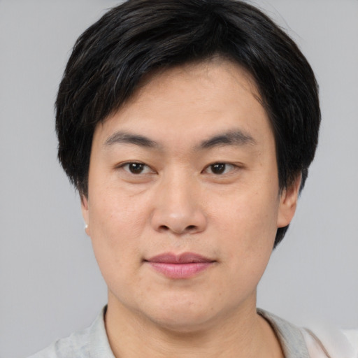 Neutral asian young-adult male with short  brown hair and brown eyes