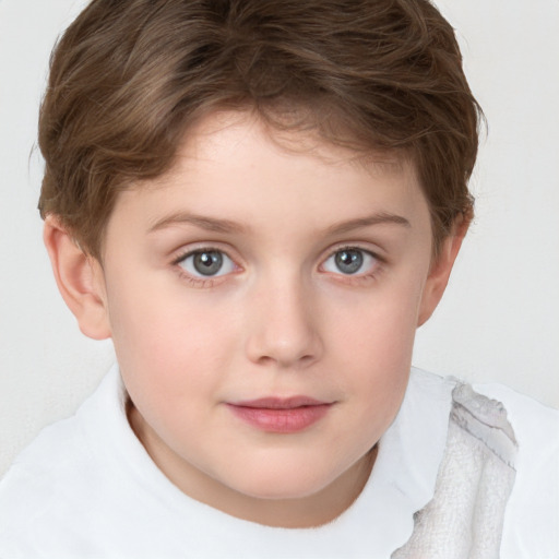 Joyful white child female with short  brown hair and blue eyes