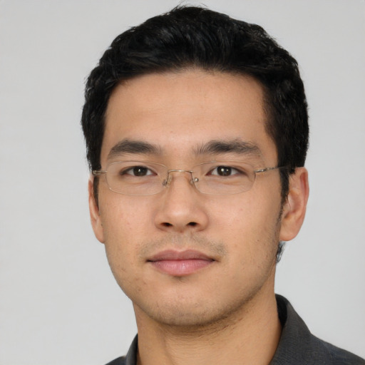 Neutral asian young-adult male with short  black hair and brown eyes