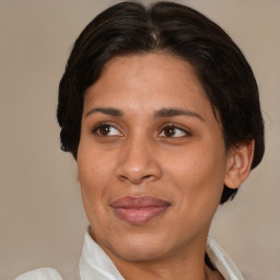 Joyful white adult female with medium  brown hair and brown eyes