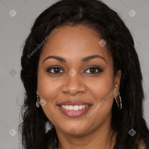 Joyful black young-adult female with long  brown hair and brown eyes