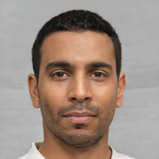 Neutral latino young-adult male with short  black hair and brown eyes