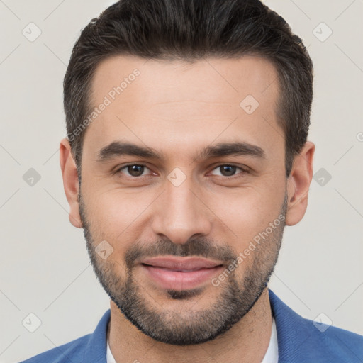 Joyful white young-adult male with short  brown hair and brown eyes