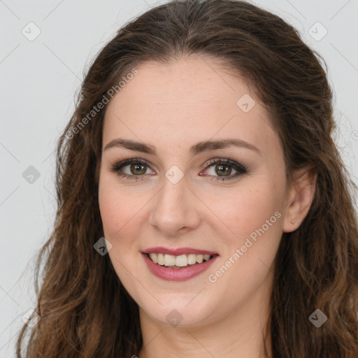 Joyful white young-adult female with long  brown hair and green eyes