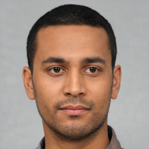 Neutral latino young-adult male with short  black hair and brown eyes