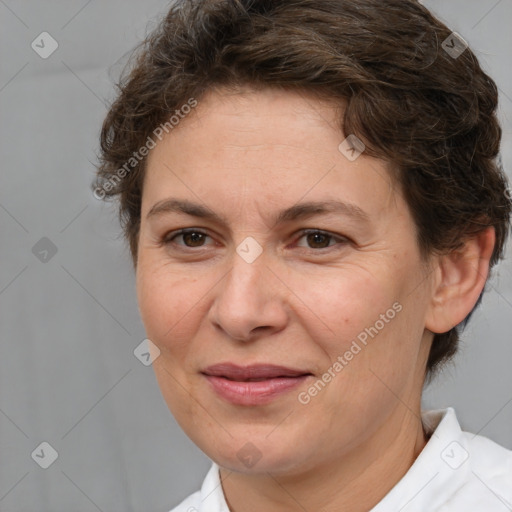 Joyful white adult female with short  brown hair and brown eyes