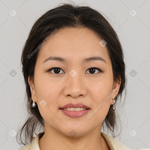 Joyful latino young-adult female with medium  brown hair and brown eyes