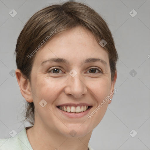 Joyful white adult female with short  brown hair and grey eyes