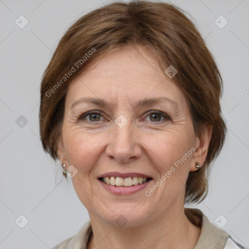 Joyful white adult female with medium  brown hair and grey eyes